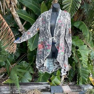 Johnny was floral reversible, cutaway jacket coat